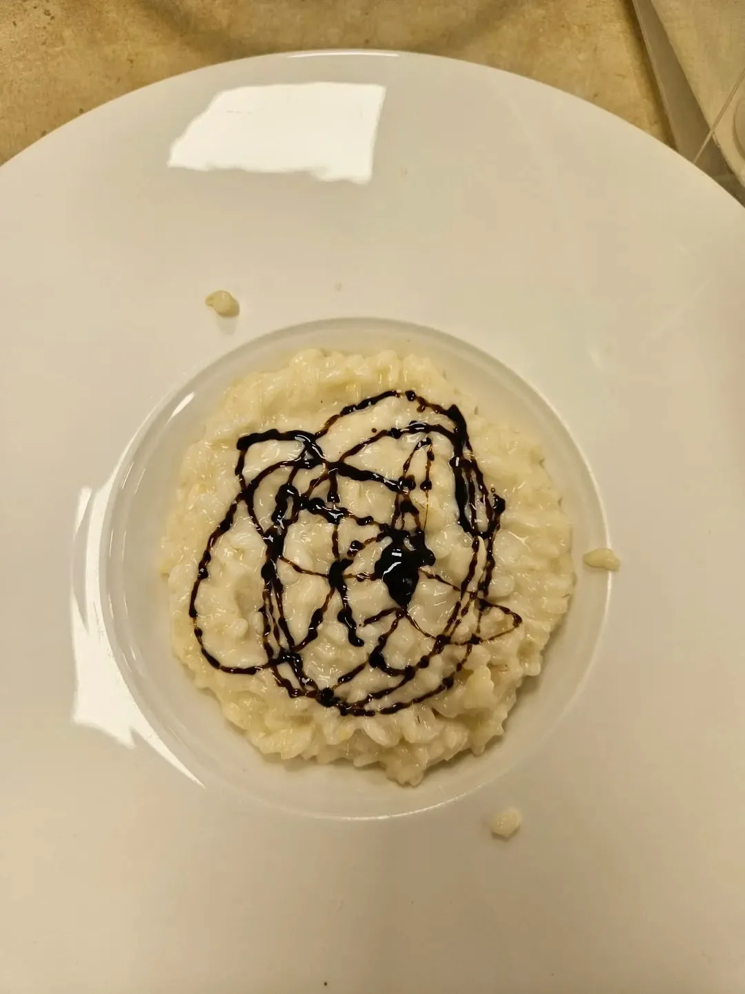 Riso cremoso con salsa scura